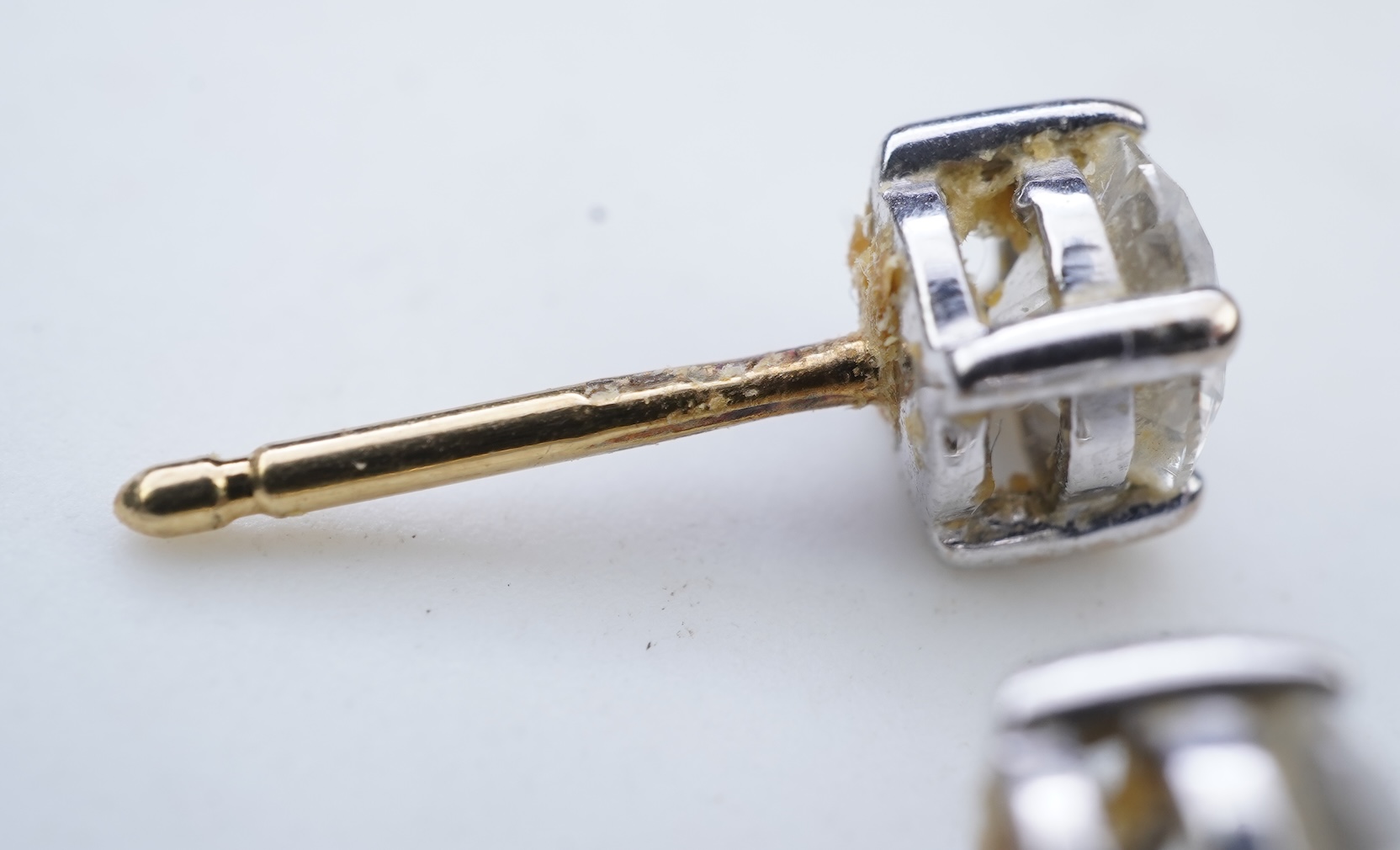 A pair of diamond stud earrings
